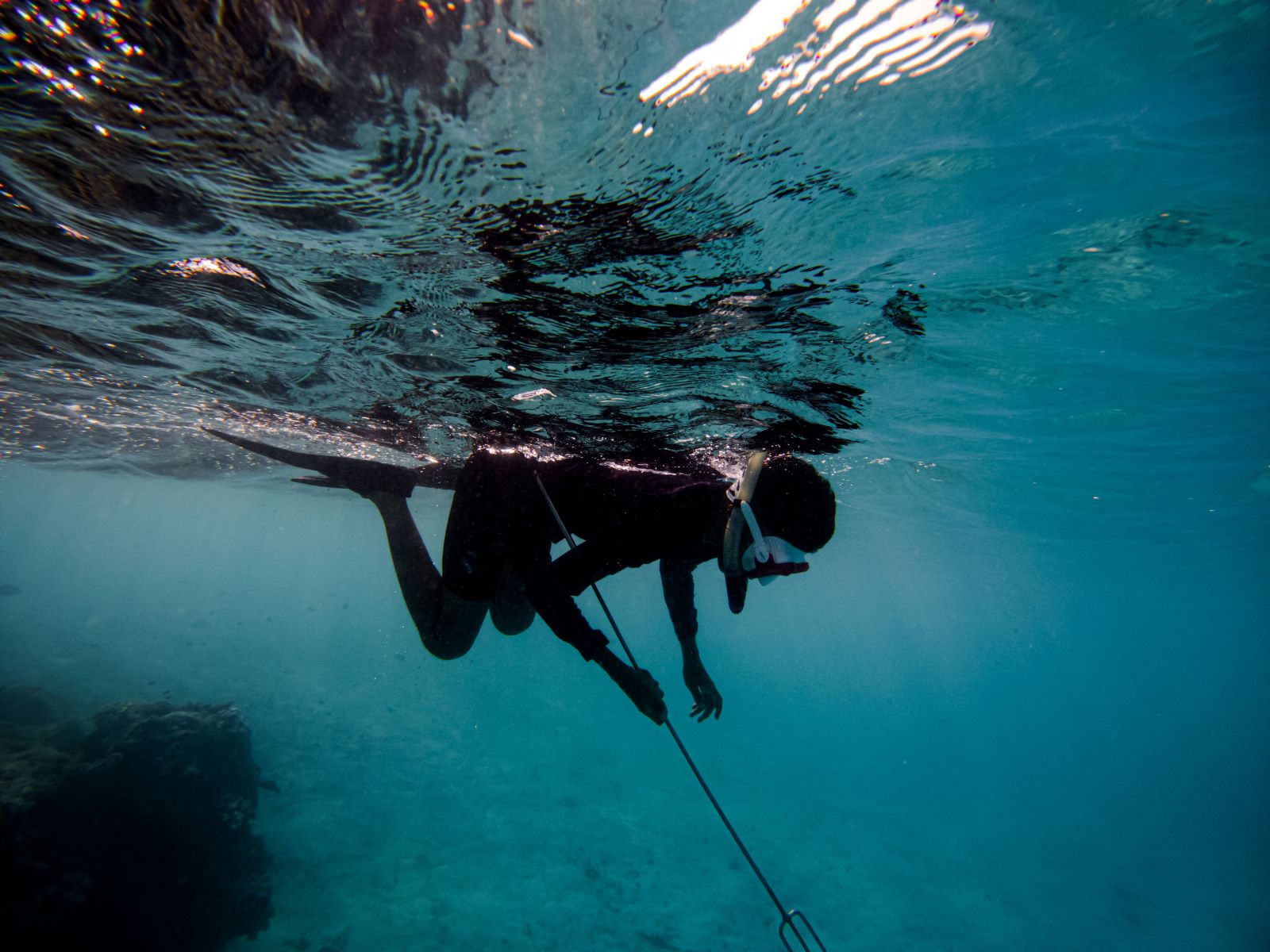 A modern person spearfishing.